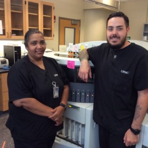 Eric Ambrozic and Renee Mason operate one of 13 automated immunostainers at UPMC.